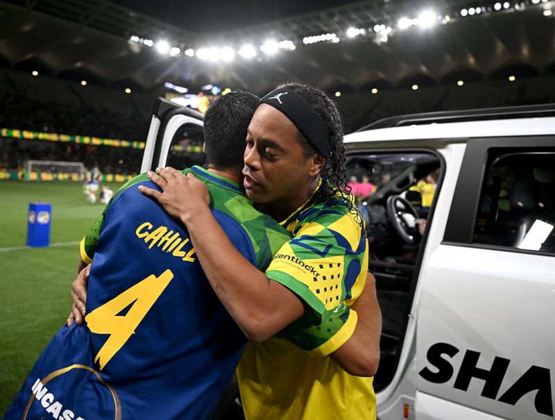 A memorable moment during a sports event showcasing an embrace between two participants. Ideal for those seeking high-profile athlete events and interactions.